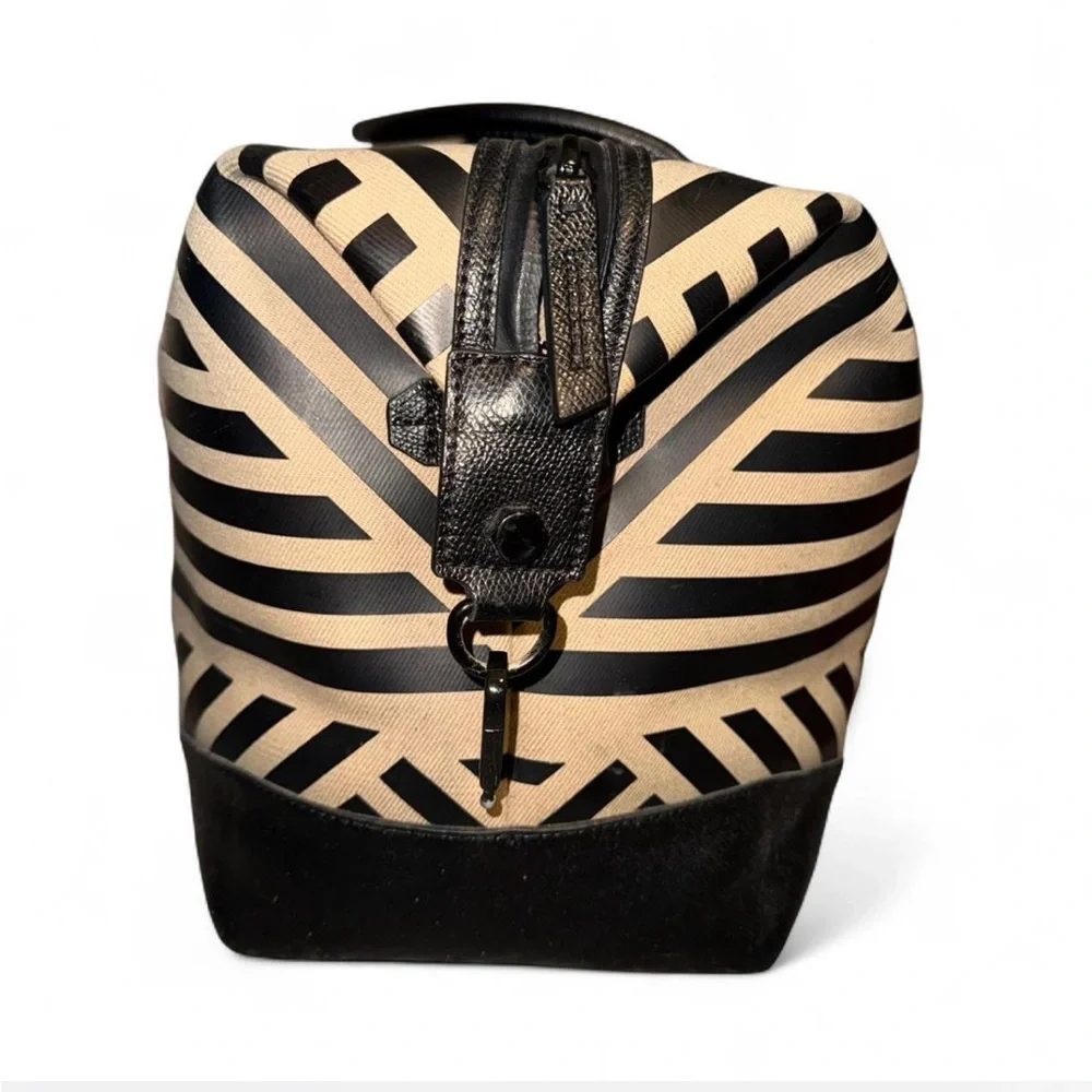 Uri Minkoff tan and black leather geometric design travel bag